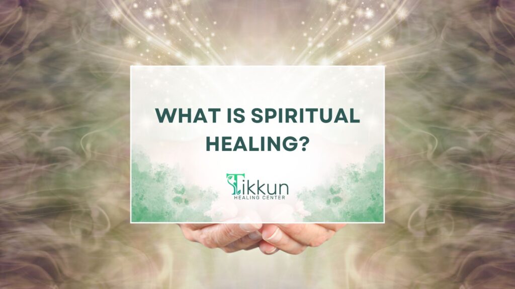 ALT tag: "At Tikkun Healing Center spiritual healing concept with hands holding a sign asking 'What is Spiritual Healing?' amidst a calming, ethereal background."